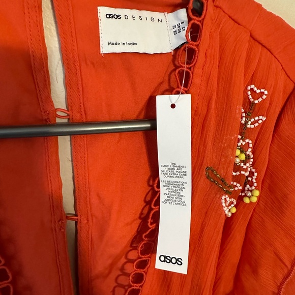 ASOS DESIGN circle trim mini dress with floral embellishment in red - Picture 5 of 8